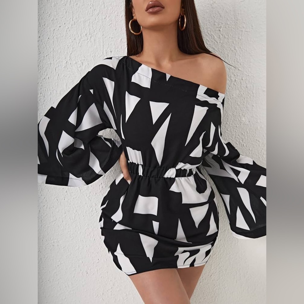BLACK & WHITE ASYMMETRICAL NECK, FLOUNCE SLEEVE